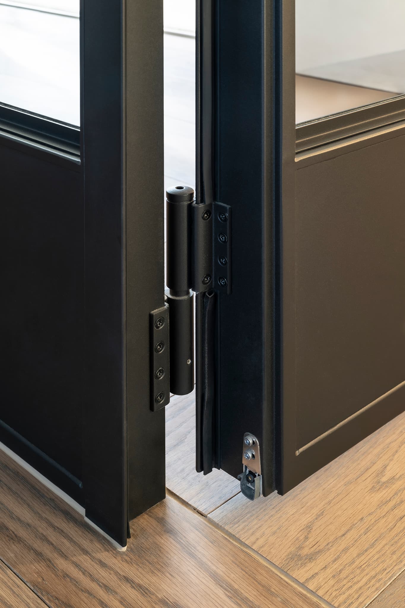 hinged sealed steel glazed internal door leading to a pantry and wine room