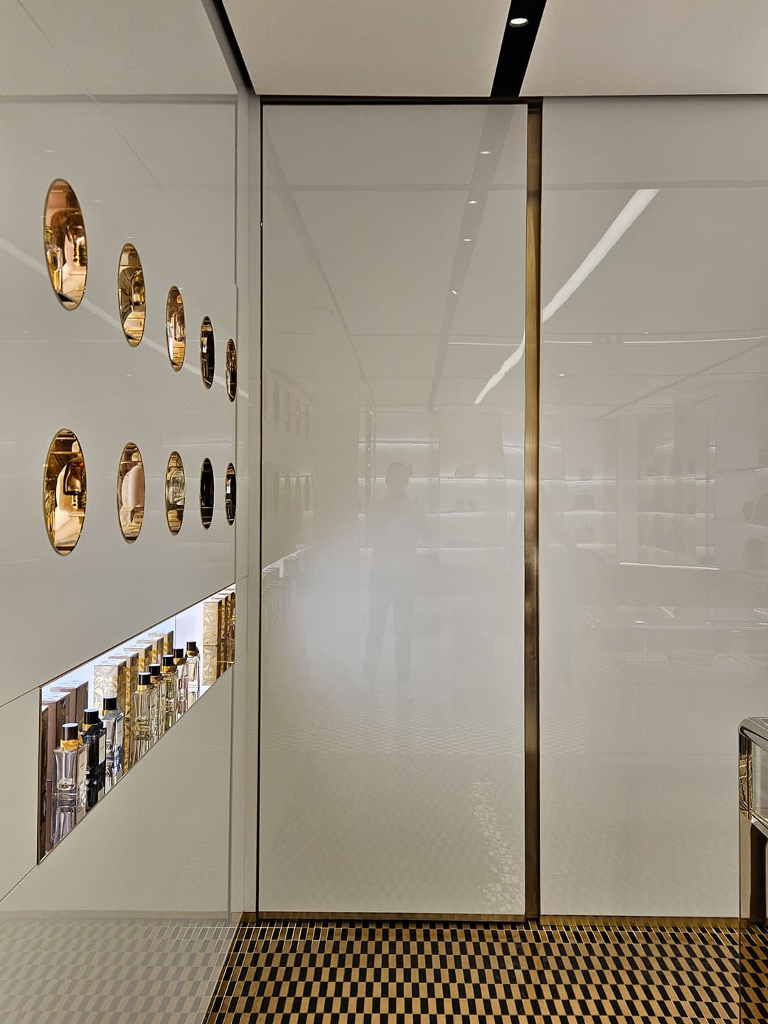 flush pivoting doors seen in the interior of the Burberry Bond Street store in London