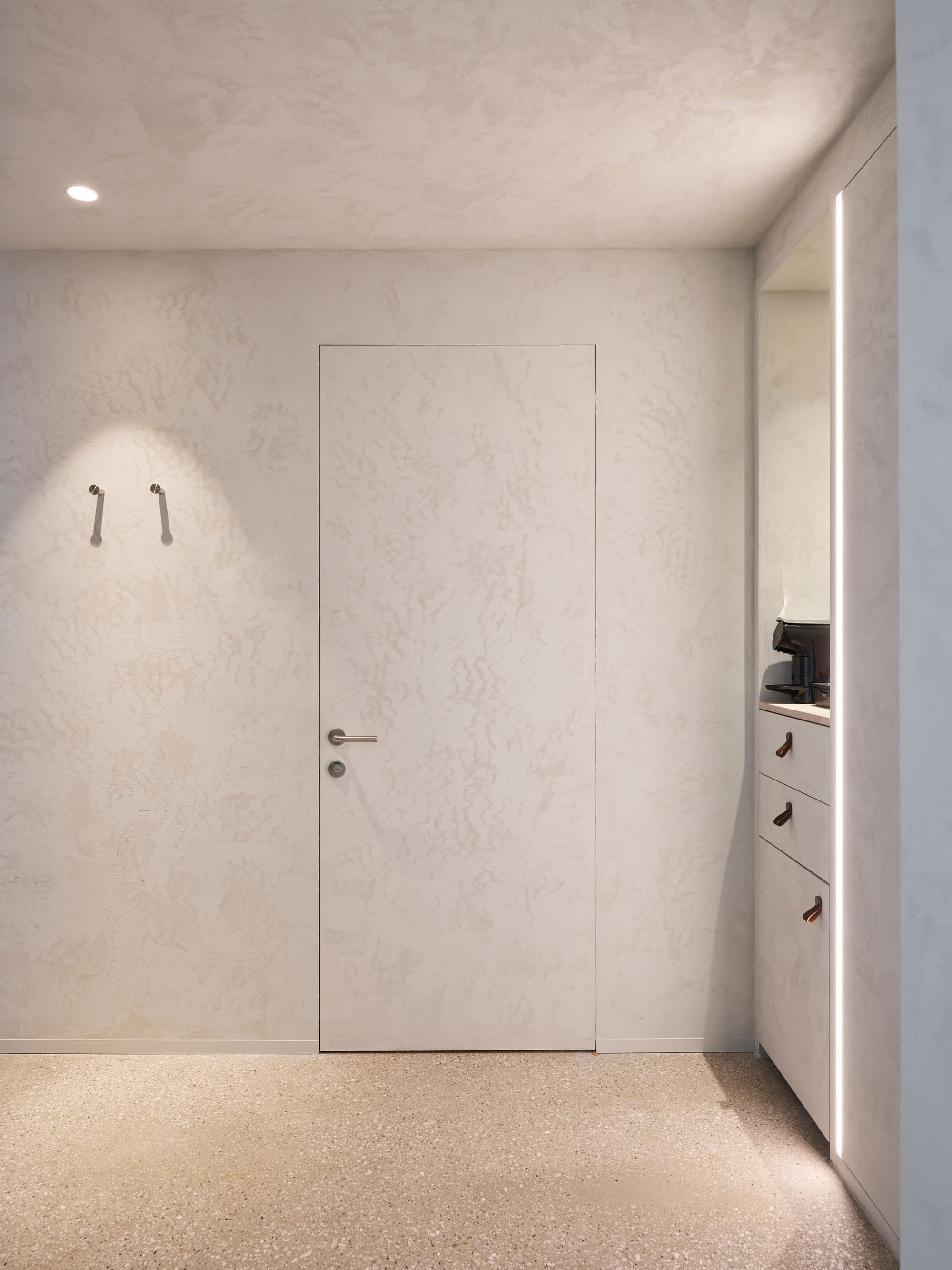 flush invisible jib door with a plaster finish in a hotel spa