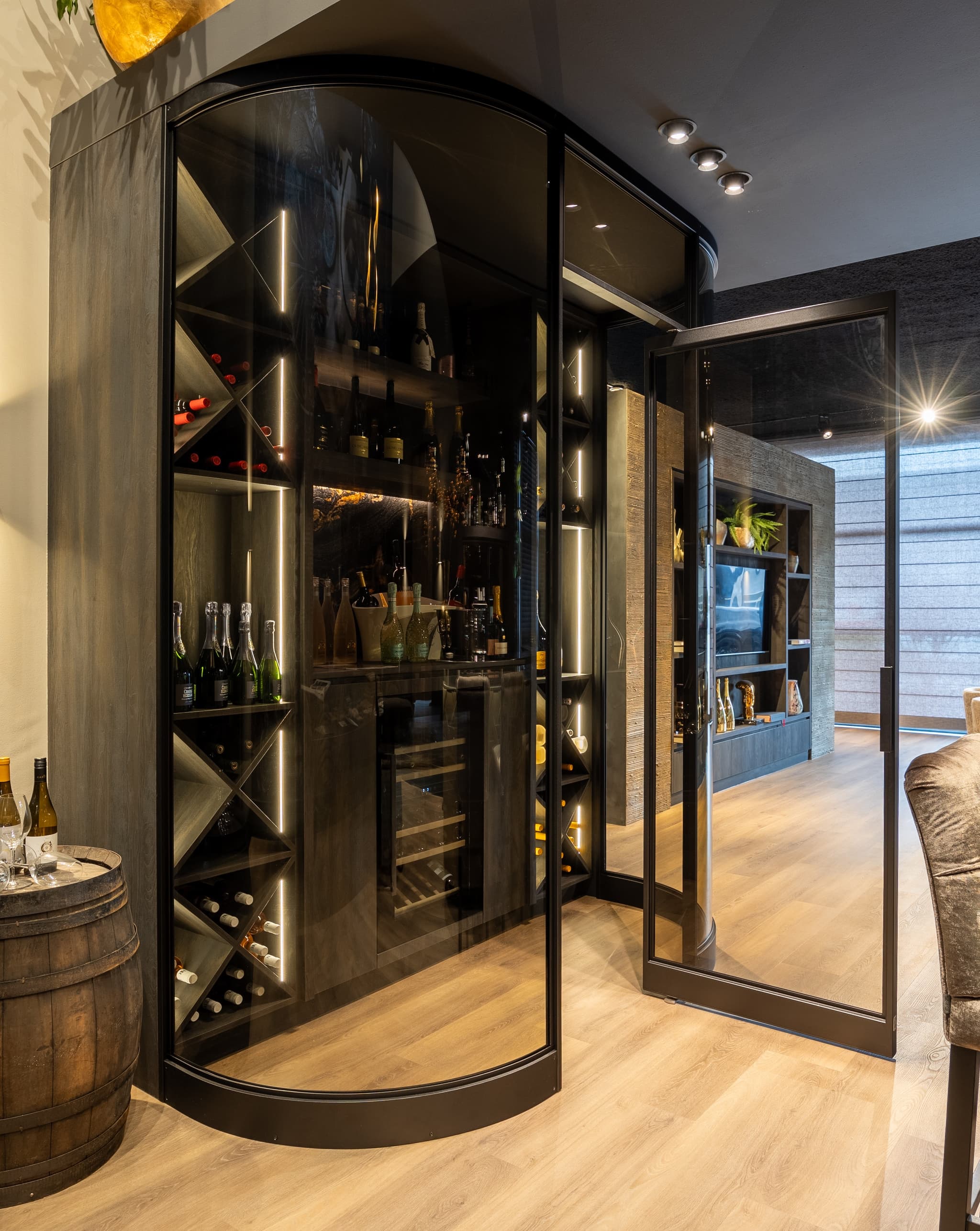 wine cabinet with curved steel glazed doors in a jet black finish