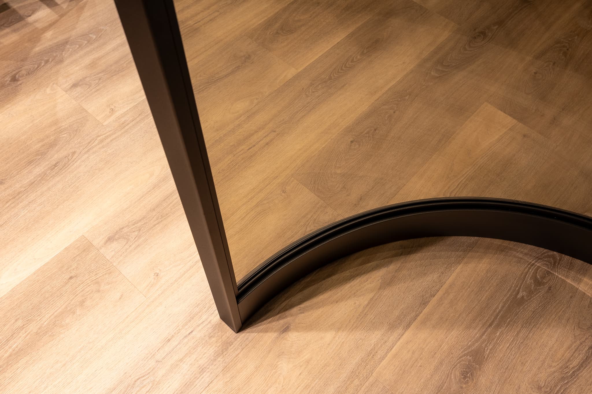 wine cabinet with curved steel glazed doors in a jet black finish