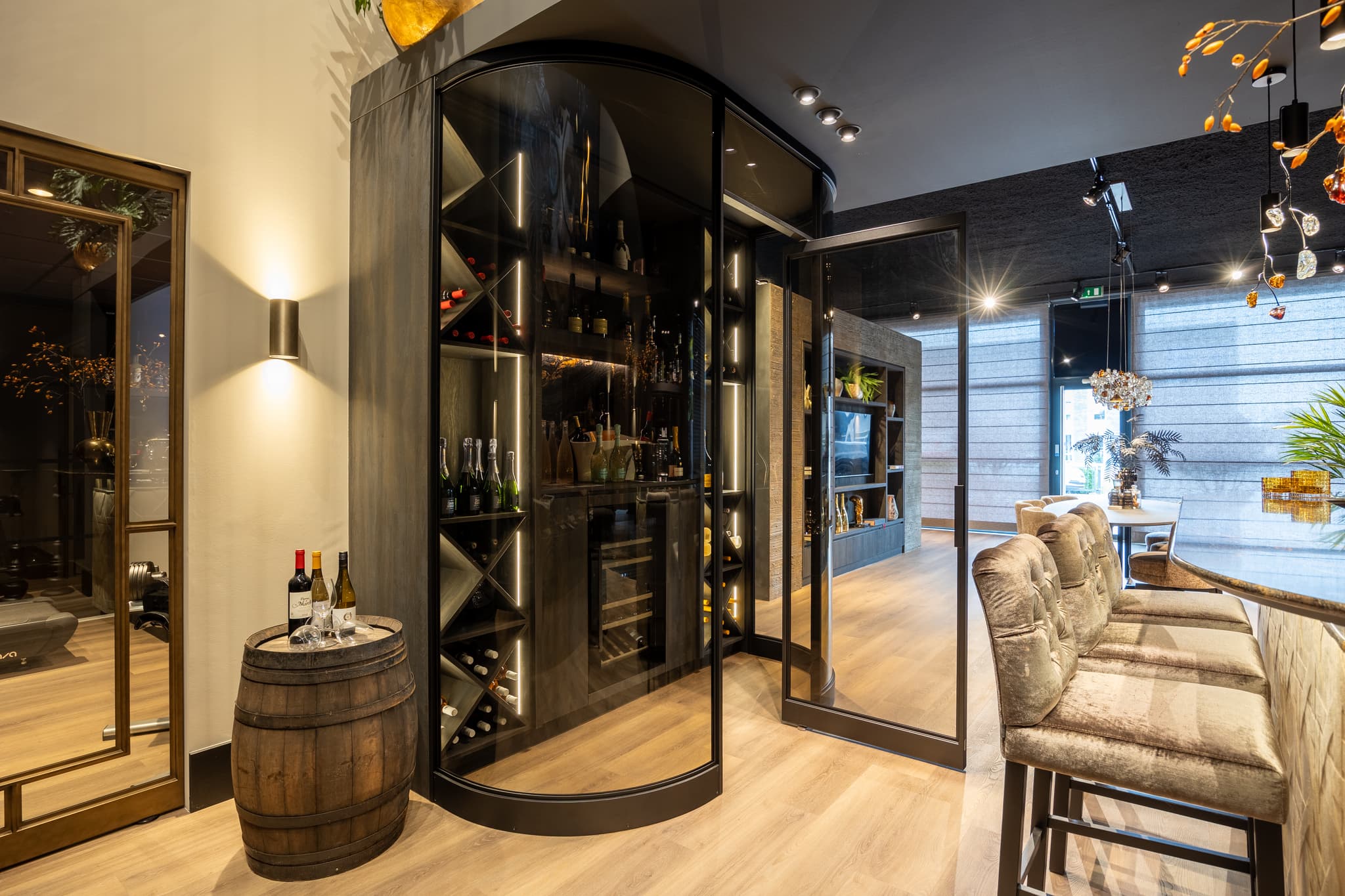 wine cabinet with curved steel glazed doors in a jet black finish