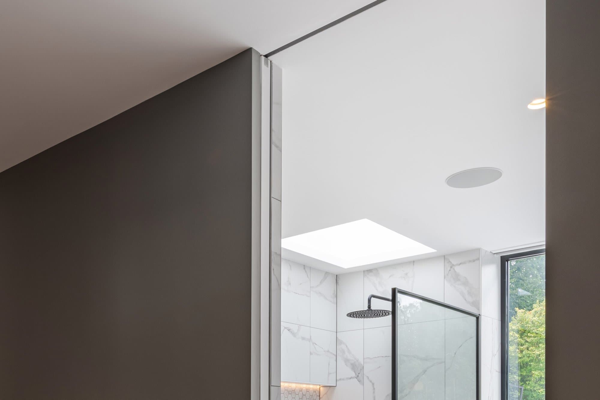 Considering a pocket door for a tiled or clad bathroom wall?