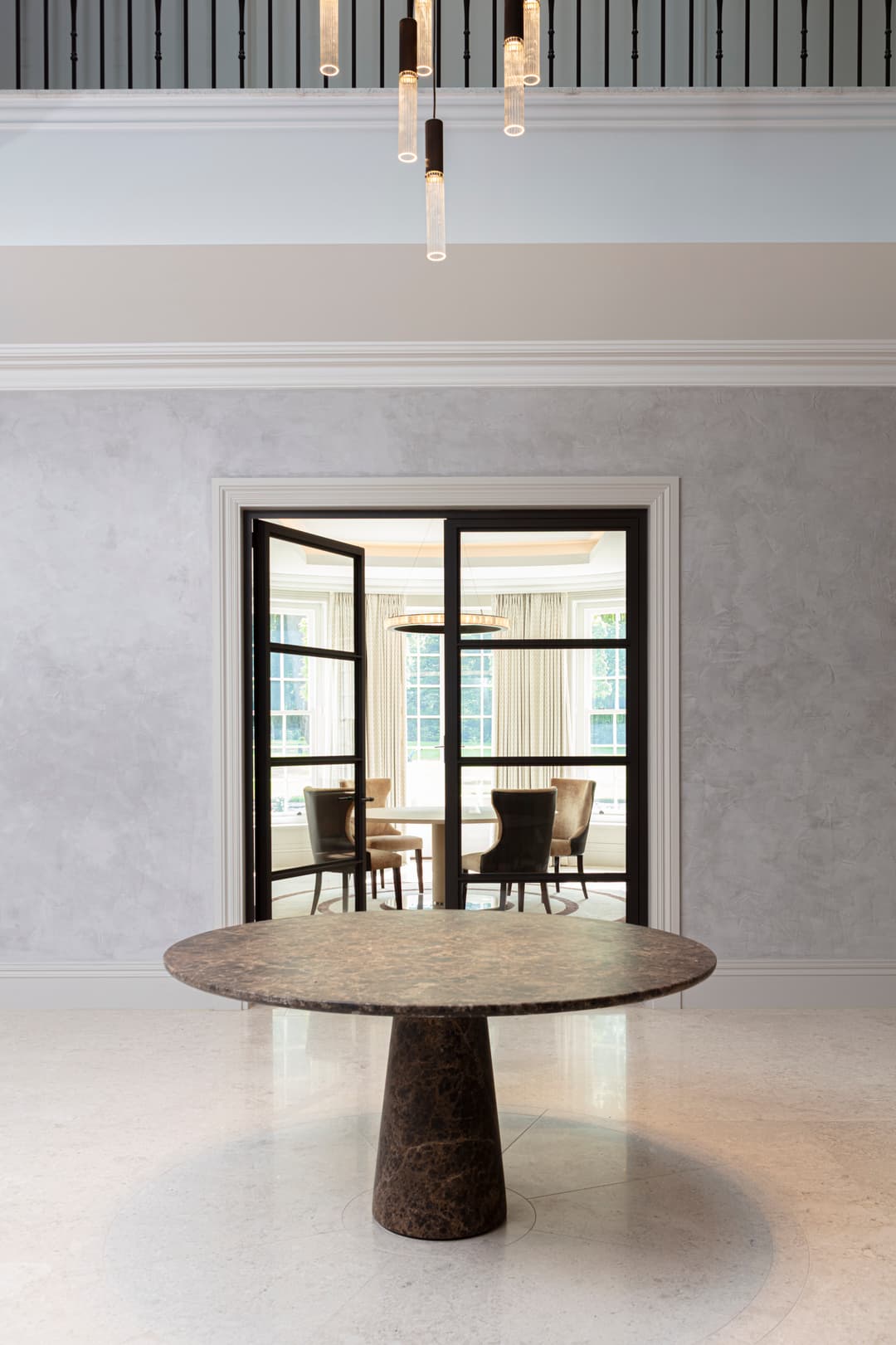 Double fire-rated steel doors with clear glass in the entrance hall of a super prime interior